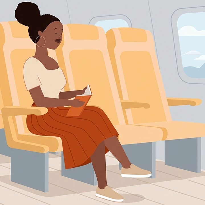 African lady on train/plane